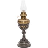 GWR Table lamp complete with reservoir, burner, glass chimney and cast iron base which has GWR