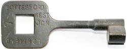 Tyers bronze single line key token BOTTESFORD WEST JCN - LOWFIELD 7. In ex railway condition.