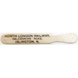 North London Railway ivorine newspaper turner, marked on one side NORTH LONDON RAILWAY CALEDONIAN