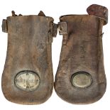 A pair of North Eastern Railway leather cash bags. One is brass plated N.E.R NORTH GRIMSTON, the