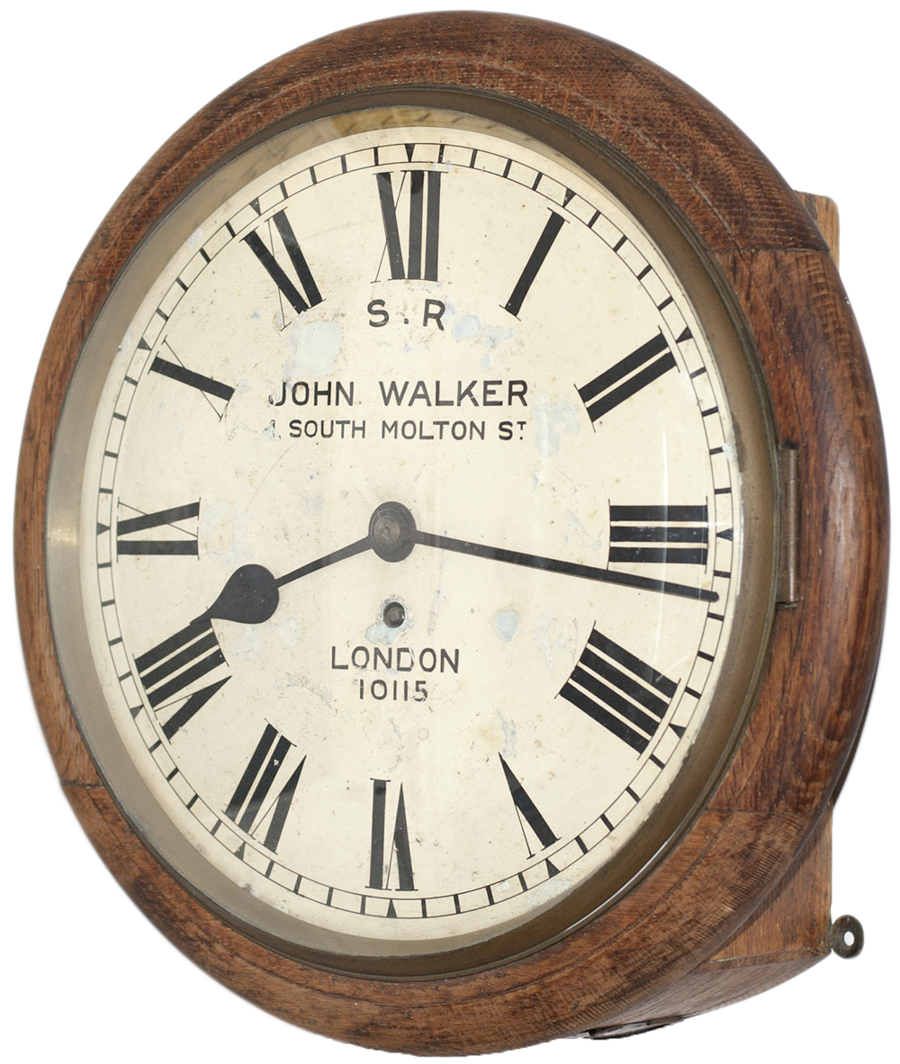 Southern Railway 12 inch oak cased fusee dial clock with wire driven movement. The original dial