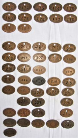 A collection of 50 GWR oval LOCO DEPT pay checks numbered 171 to 240 with missing numbers. Recovered