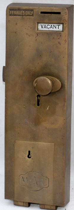 Brass toilet door lock. To open door insert one penny.
