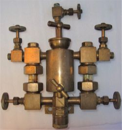 Brass lubricating sight glass manifold possibly of traction or stationary steam engine. A