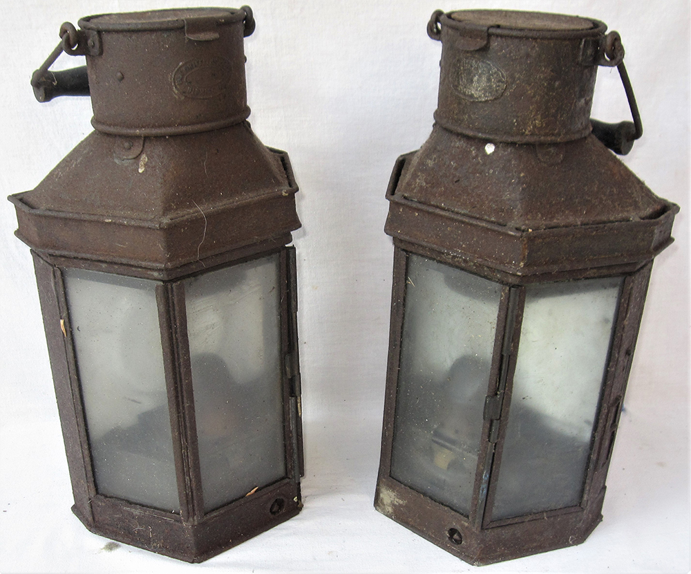 A pair of removable wall mounted oil lamps. Unknown purpose in original condition.