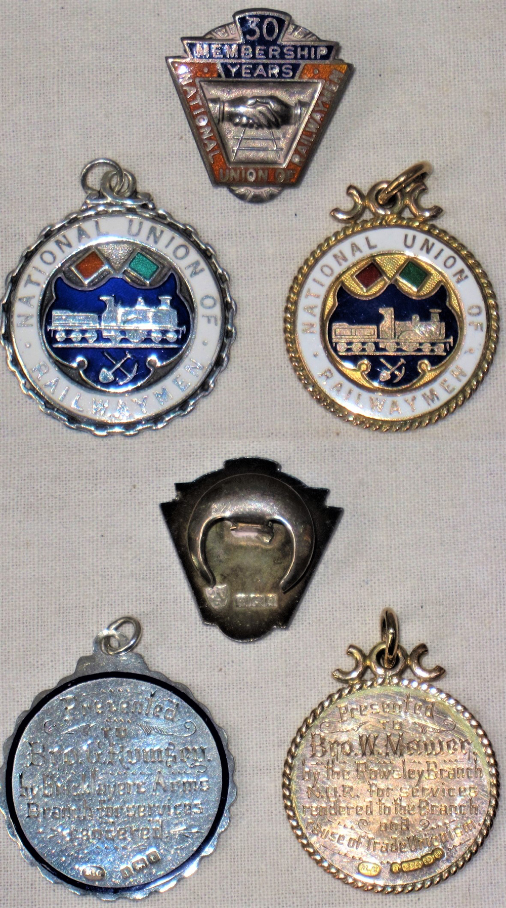 A lot containing N.U.R sterling silver 30 years membership badge together with N.U.R. 9ct gold and