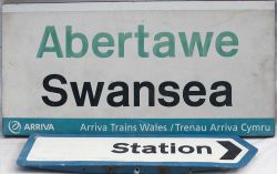 BR Station direction sign and an ARRIVA SWANSEA Station Sign.