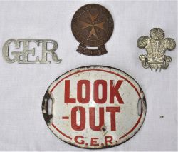 A collection of GER items to include a GER detonator case badge. A GER sew on ambulance arm badge. A