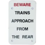 British Railways enamel sign BEWARE TRAINS APPROACH FROM THE REAR measuring 11in x 6in. In excellent