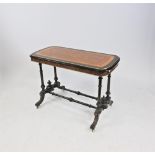 A Victorian ebony satinwood crossbanded and amboyna inlaid gilt metal centre table