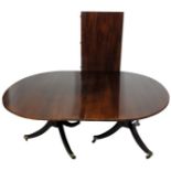 A mahogany twin pillar dining table