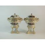 A pair of German porcelain pot pourri vases and covers