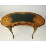A Victorian walnut and foliate inlaid and crossbanded kidney shaped desk