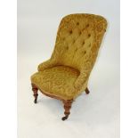 A Victorian oak framed nursing chair