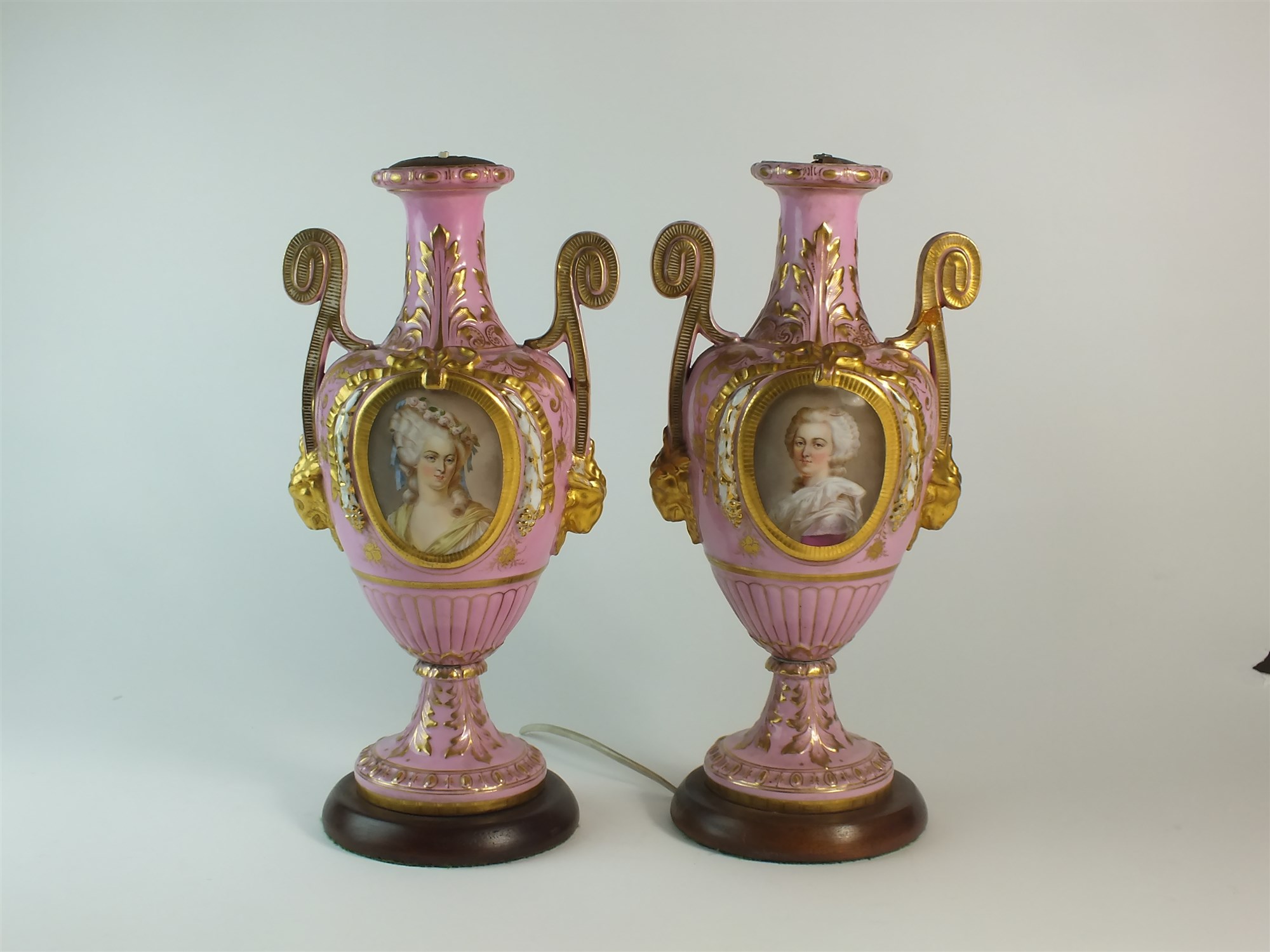 A pair of French porcelain vases converted to lamps