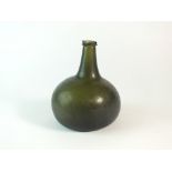 An 18th century glass onion bottle (chipped)