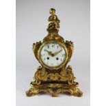 A Louis XV style gilt metal mantel clock