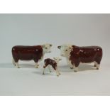 A Beswick Hereford family group of cattle