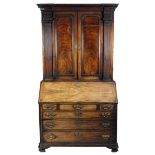 A George III mahogany bureau cabinet, circa...