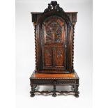 A Victorian carved oak bookcase cabinet on stand