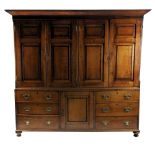 An oak and mahogany cross banded housekeepers cupboard second quarter 19th century