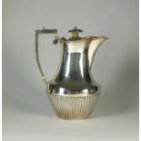 A silver hot water jug