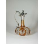 An early Victorian silver mounted amber flashed glass claret jug