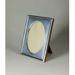 An early 20th century silver and blue guilloche enamel effect frame
