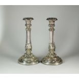 A pair of George IV silver mounted candlesticks