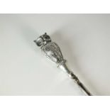 An Edwardian silver mounted owl button hook