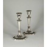 A pair of silver candlesticks