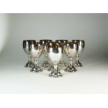 A set of eight silver goblets