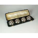 A cased set of four Edwardian novelty silver menu holders