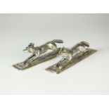A pair of Victorian silver 'fox' knife rests