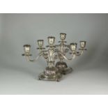 A pair of Egyptian silver candelabra