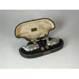 A cased pair of Edwardian novelty silver duck salts