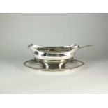 An Egyptian silver sauce boat on stand