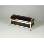 A silver mounted tortoiseshell musical trinket box