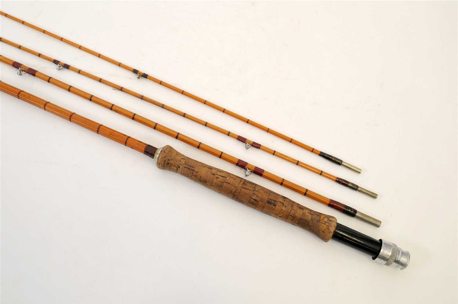 A 20th century Hardy three-sectional split cane fishing rod