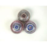 Three Arculus or Walsh Walsh millefiore glass paperweights