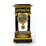 A French ormolu and bronze empire style portico clock