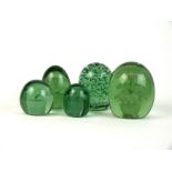 Five Victorian green glass dump paperweights