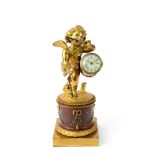 A French ormolu and variegated red marble mantel time piece