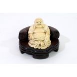 A Japanese carved ivory figure of Hotei, Meiji period