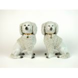 A pair of Continental porcelain shredded clay poodles