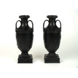 A pair of Wedgwood black basalt vases