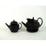 Two English black basalt teapots and covers