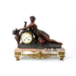 A French bronze patinated spelter and Breche d'Alep clock garniture