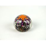 A floral glass paperweight