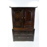 An 18th century carved oak linen press